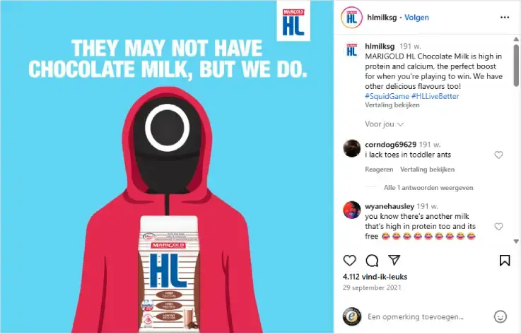Screenshot van Instagram-post van hlmilksg met illustratie geïnspireerd op Squid Game: figuur in rood pak met masker houdt pak HL chocolade­melk vast. Tekst: 'They may not have chocolate milk, but we do.' Realtime marketing op social media.