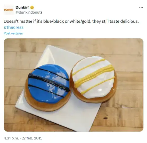 Screenshot van Twitter-post van Dunkin’ Donuts die inspeelt op de virale discussie over the dress. Twee donuts op een bord: één blauw met zwarte lijnen en één wit met gouden lijnen. Tekst: 'Doesn’t matter if it’s blue/black or white/gold.' Realtime marketing op social media. 