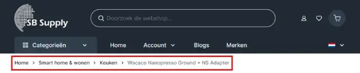 Screenshot van de SB Supply‑webshop met breadcrumb‑navigatie: Home > Smart home & wonen > Keuken > Wacaco Nanopresso Ground + NS Adapter. Navigatie toont de productlocatie binnen de keukencategorie.