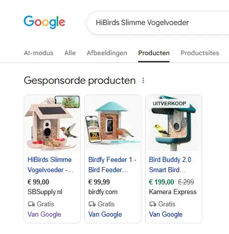 Screenshot van Google Shopping-resultaten voor 'HiBirds Slimme Vogelvoeder' met gesponsorde producten zoals slimme vogelvoeders met camera, prijzen, webshopnamen en labels als gratis verzending en uitverkoop, zichtbaar in het tabblad Producten.
